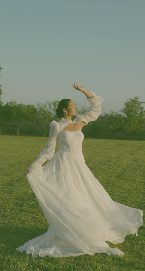 Bride moving through a field